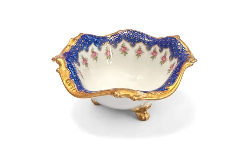Scalloped blue-and-gold porcelain footed bowl with pink rose decoration