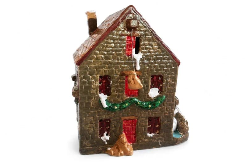 Ceramic Christmas Village House with Stone-Textured Walls and Green Garland