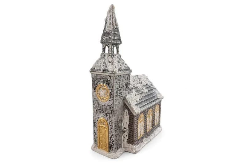 Snow-dusted resin church miniature with steeple and gold-tone doors